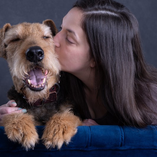 Haley Ducote, Training Program Lead, with her Airedale Tripp